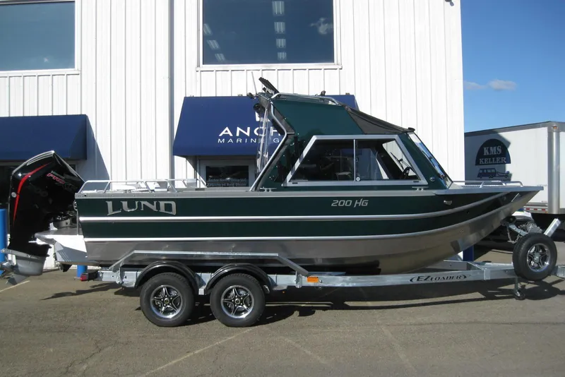 The Image of 2026 Lund 200 Heavy Gauge boat on trailer, side view. - 0