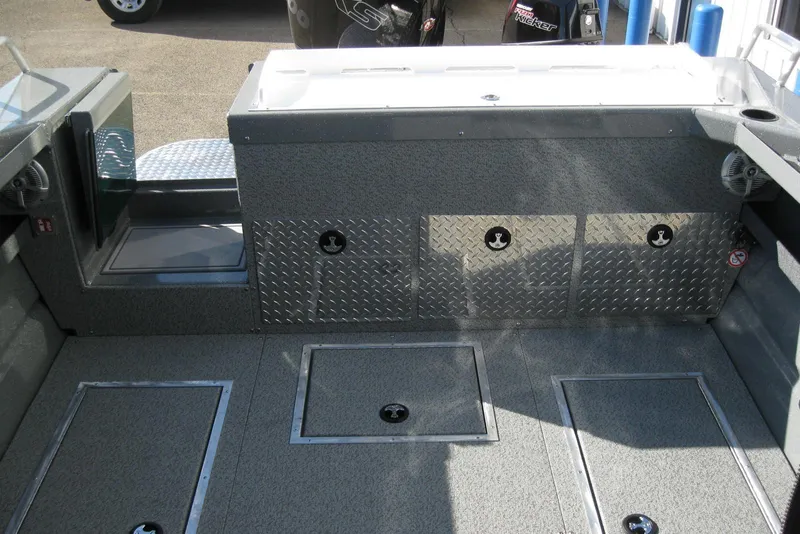 Slide: The Image of Interior view of 2026 Lund 200 Heavy Gauge boat, featuring sleek design and durable materials. - 12