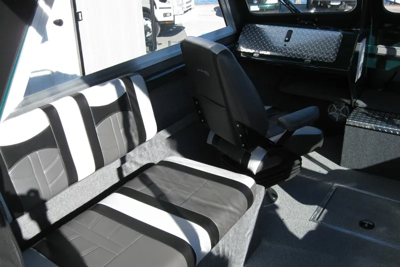 Slide: The Image of Interior of 2026 Lund 200 Heavy Gauge boat with modern seating and steering console. - 15