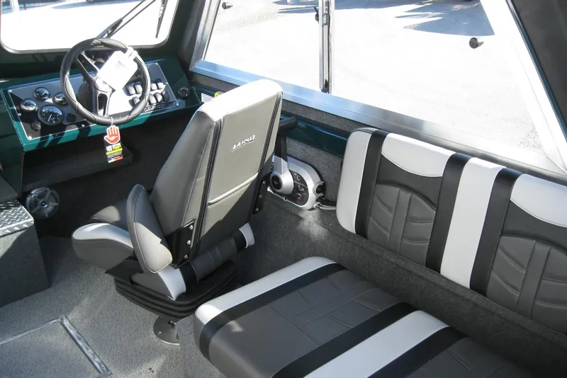 Slide: The Image of Interior of 2026 Lund 200 Heavy Gauge boat with modern seating and dashboard. - 16