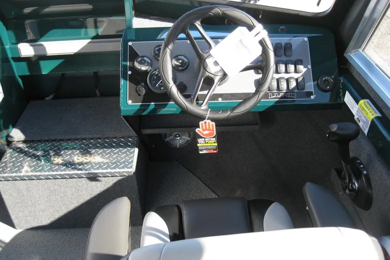 Slide: The Image of Interior of 2026 Lund 200 Heavy Gauge boat with diamond plate accents and seating. - 18