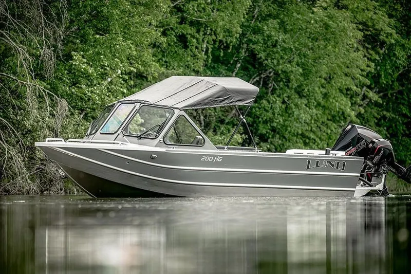 Slide: The Image of Manufacturer Provided Image: Top view of 2025 Lund 200 Heavy Gauge boat with dual engines and seating layout. - 23