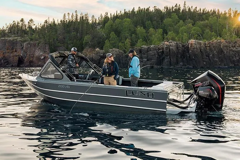 Slide: The Image of Manufacturer Provided Image: 2025 Lund 200 Heavy Gauge boat cruising on open water. - 25