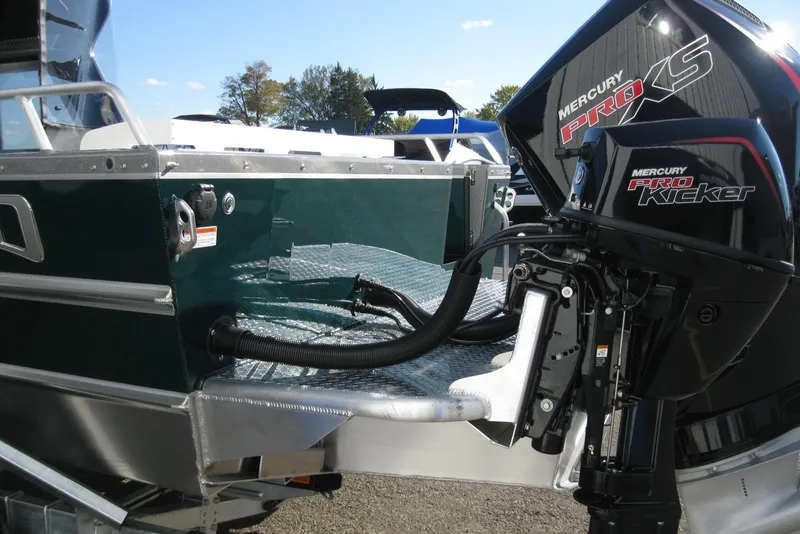 Slide: The Image of 2026 Lund 200 Heavy Gauge boat with dual Mercury outboard motors. - 7