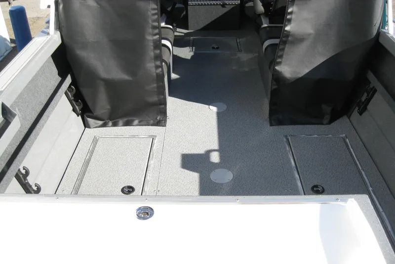 Slide: The Image of 2026 Lund 200 Heavy Gauge boat with diamond plate flooring and green exterior. - 9