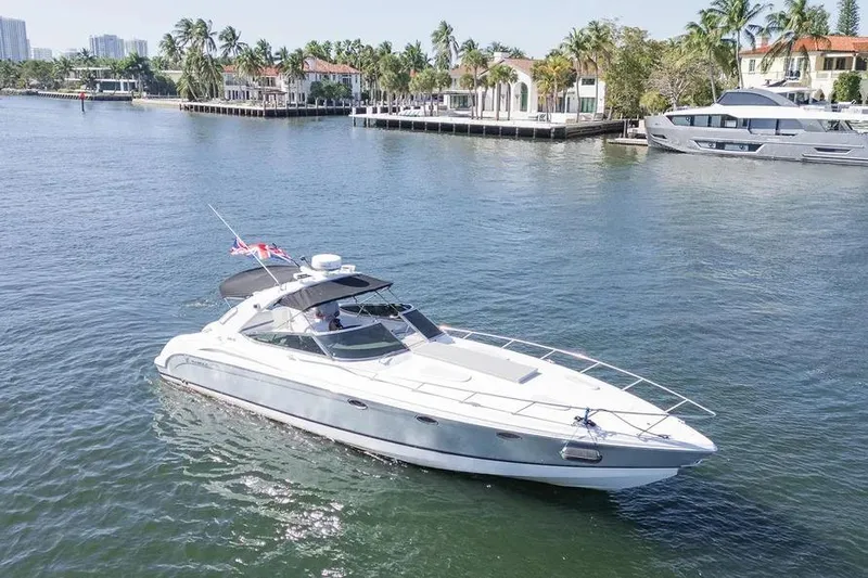 The Image of 2004 Formula 400 Super Sport Crossover yacht cruising on a sunny waterfront. - 0