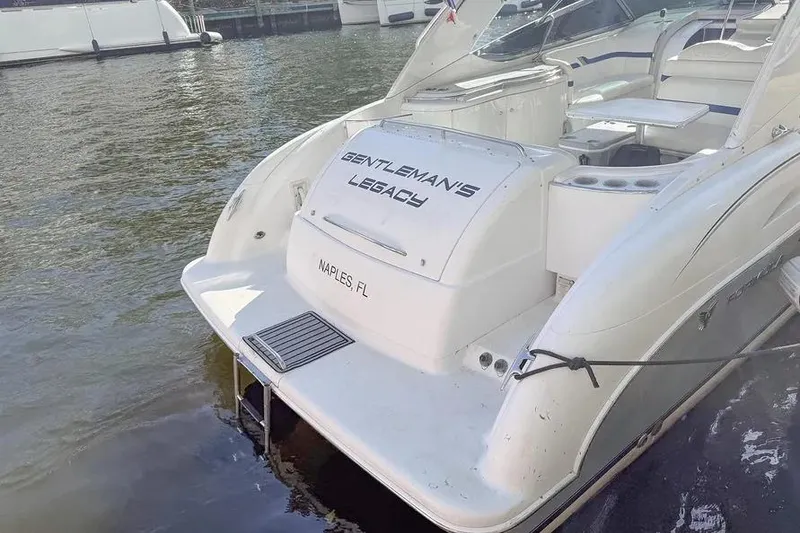 Slide: The Image of 2004 Formula 400 Super Sport Crossover boat docked, labeled "Gentleman's Legacy," Naples, FL. - 12