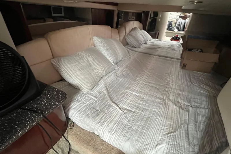 Slide: The Image of Interior cabin of 2004 Formula 400 Super Sport Crossover with cozy bedding setup. - 16