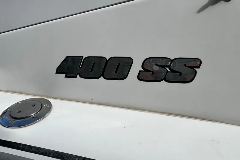 Slide: The Image of 2004 Formula 400 Super Sport Crossover boat emblem on white surface. - 18