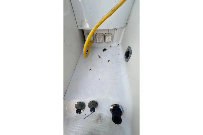 Slide: The Image of 2004 Formula 400 Super Sport Crossover boat deck with yellow cable and utility outlets. - 21