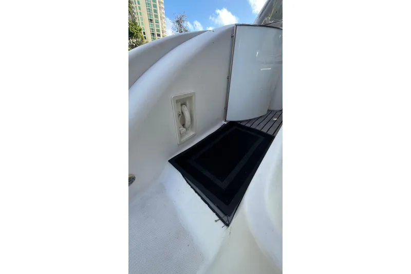 Slide: The Image of 2004 Formula 400 Super Sport Crossover boat deck with hatch and door. - 22