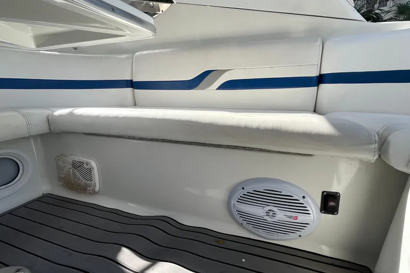 Slide: The Image of Interior seating of 2004 Formula 400 Super Sport Crossover boat with speaker and blue accents. - 24