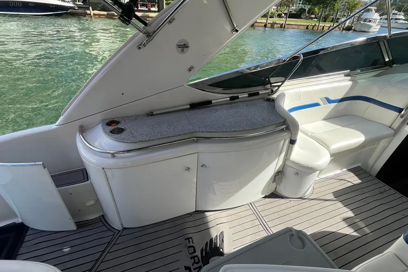 Slide: The Image of 2004 Formula 400 Super Sport Crossover boat interior with seating and countertop. - 26