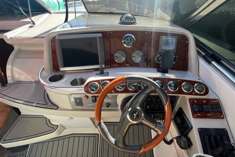 Slide: The Image of Control panel of a 2004 Formula 400 Super Sport Crossover boat with wood accents. - 29