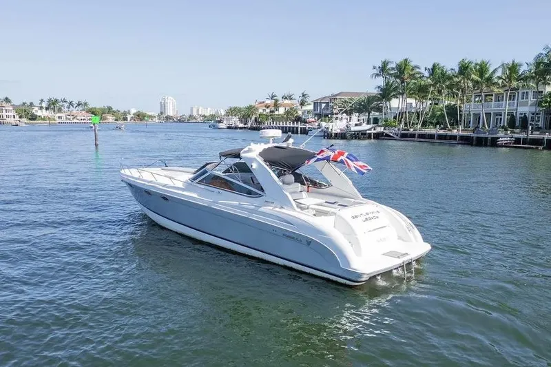 Slide: The Image of 2004 Formula 400 Super Sport Crossover yacht cruising on a sunny waterfront. - 3