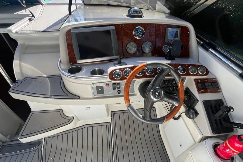 Slide: The Image of Helm of 2004 Formula 400 Super Sport Crossover with wood accents and modern controls. - 33