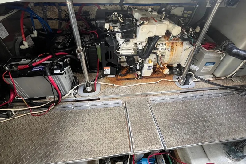 Slide: The Image of Engine room of 2004 Formula 400 Super Sport Crossover with Kohler power system and batteries. - 37