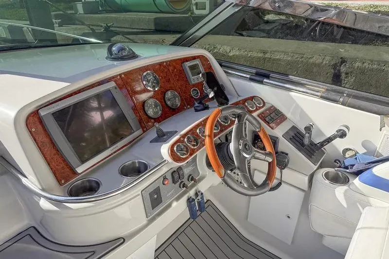 Slide: The Image of Cockpit of 2004 Formula 400 Super Sport Crossover with wood accents and modern controls. - 5