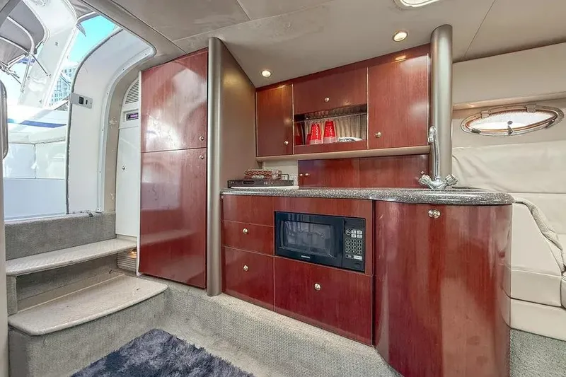 Slide: The Image of Luxurious interior of 2004 Formula 400 Super Sport Crossover yacht with kitchenette and microwave. - 6