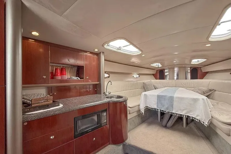 Slide: The Image of Luxurious interior of 2004 Formula 400 Super Sport Crossover yacht with kitchenette and seating area. - 7