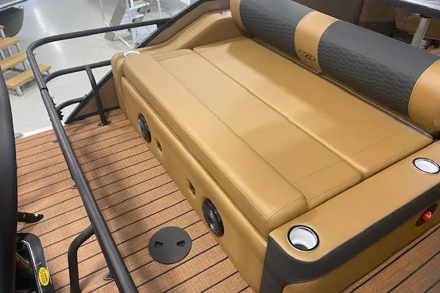 Slide: The Image of 2026 Bentley Pontoons Elite 253 Swingback with tan seating and cup holders. - 20