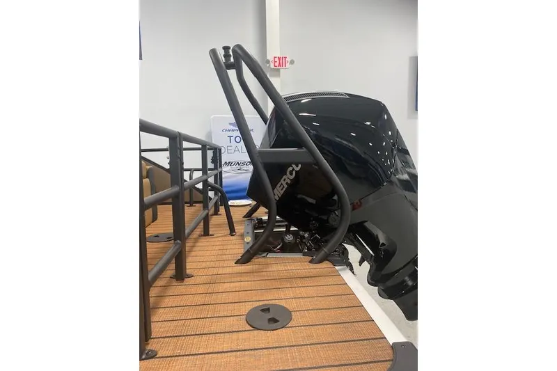 Slide: The Image of 2026 Bentley Pontoons Elite 253 Swingback with Mercury engine, showcased indoors. - 3