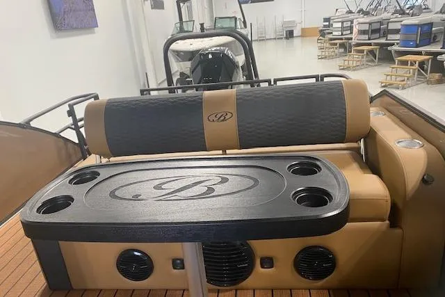 Slide: The Image of 2026 Bentley Pontoons Elite 253 Swingback interior with luxury seating and table. - 5