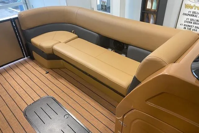 Slide: The Image of Luxurious interior of 2026 Bentley Pontoons Elite 253 Swingback with tan seating and wood flooring. - 12