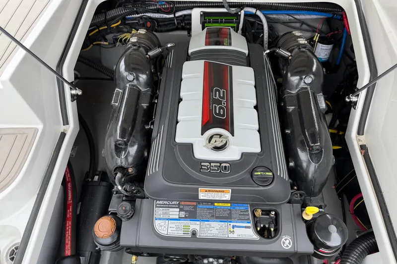 Slide: The Image of Engine compartment of 2023 Crownline 280 SS boat featuring a Mercury 6.2L 350 HP engine. - 13