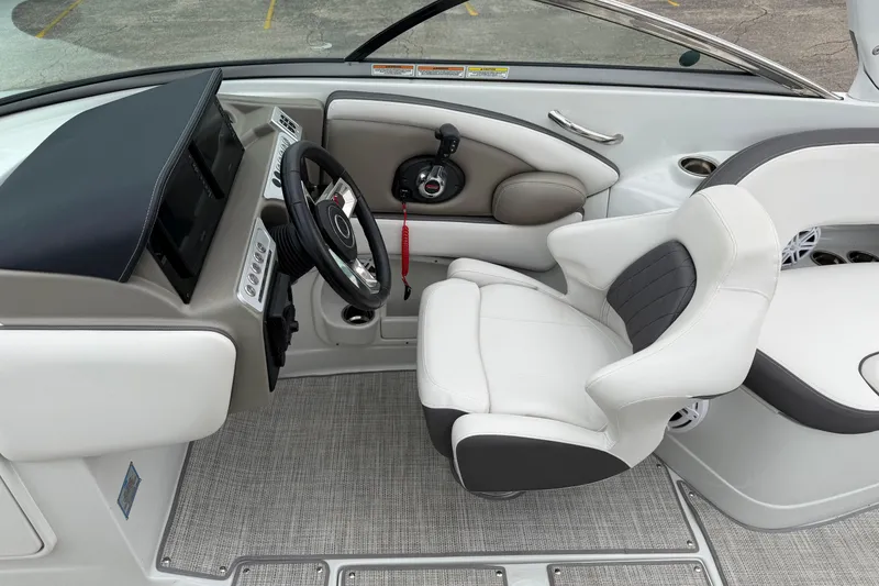 Slide: The Image of 2023 Crownline 280 SS boat interior with modern helm and comfortable seating. - 18