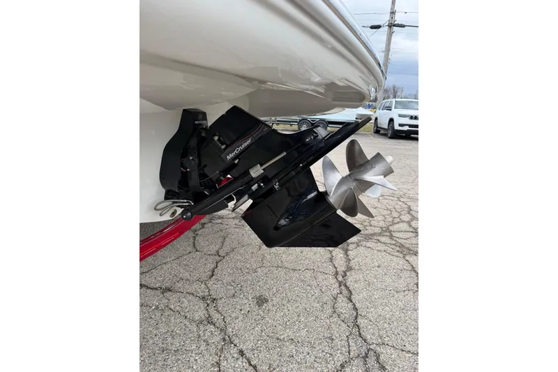 Slide: The Image of 2023 Crownline 280 SS boat with MerCruiser outdrive and propeller. - 19