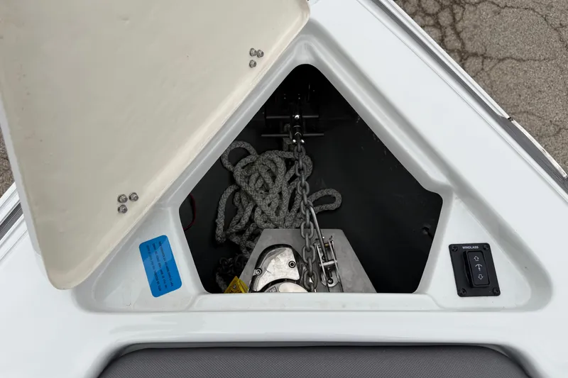 Slide: The Image of Anchor storage compartment of 2023 Crownline 280 SS boat with rope and chain. - 3