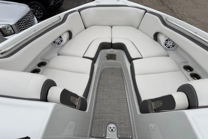 Slide: The Image of 2023 Crownline 280 SS boat interior with white seating and cup holders. - 9