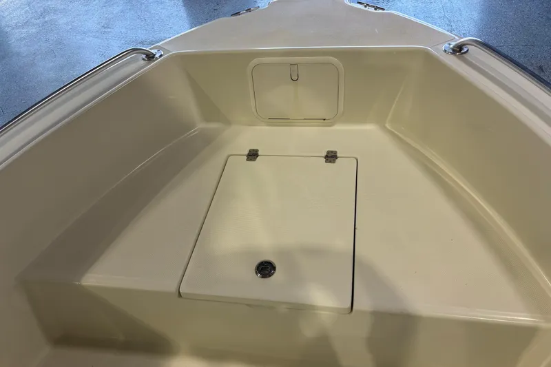 Slide: The Image of 2016 Release 180 CC boat interior with storage compartments and clean design. - 17