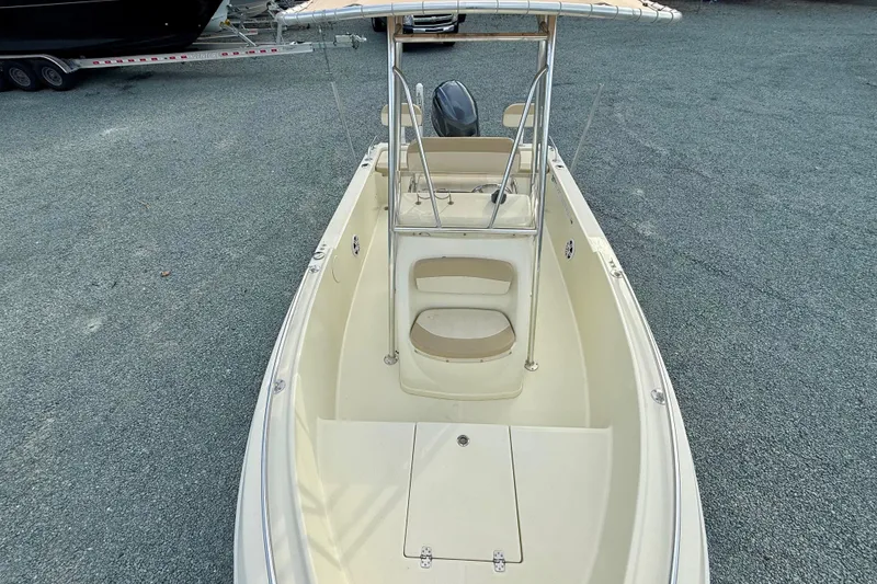 Slide: The Image of 2016 Release 180 CC boat with center console and seating, parked on gravel. - 19