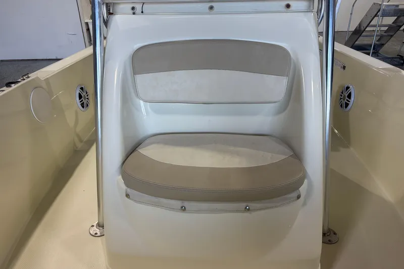 Slide: The Image of Boat seat on a 2016 Release 180 CC, featuring beige and white upholstery. - 23