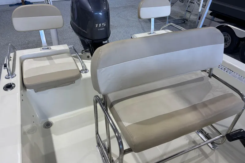 Slide: The Image of 2016 Release 180 CC boat interior with Yamaha 115 engine and cushioned seating. - 25