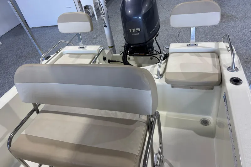 Slide: The Image of 2016 Release 180 CC boat interior with Yamaha 115 engine and cushioned seating. - 26