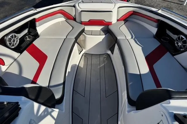 Slide: The Image of 2020 Yamaha Boats 242X E-Series interior with red and gray seating, featuring modern design. - 17