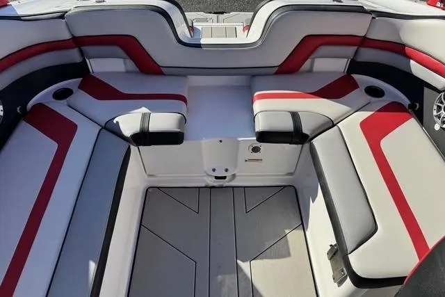 Slide: The Image of 2020 Yamaha Boats 242X E-Series interior with red and gray seating. - 25
