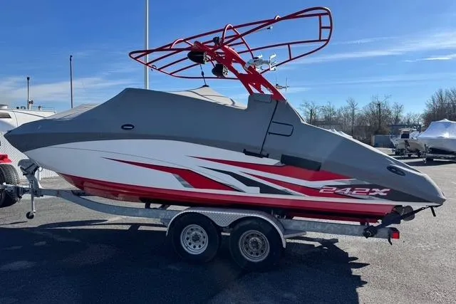 Slide: The Image of 2020 Yamaha Boats 242X E-Series on trailer, featuring sleek design and vibrant red accents. - 4