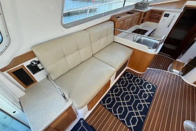 Slide: The Image of Interior of 2015 Back Cove 37 yacht with seating and wooden flooring. - 10