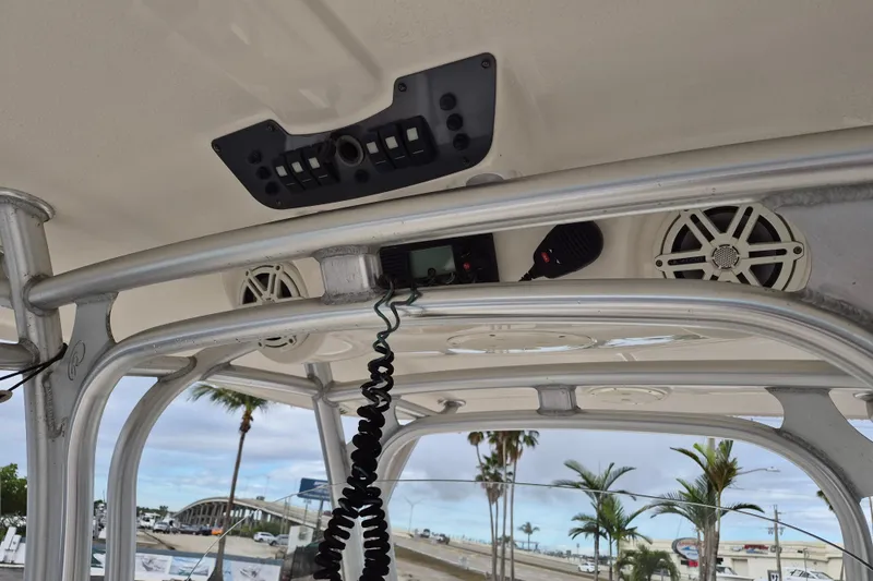 Slide: The Image of 2014 Robalo R300 Center Console boat interior with speakers and control panel. - 16