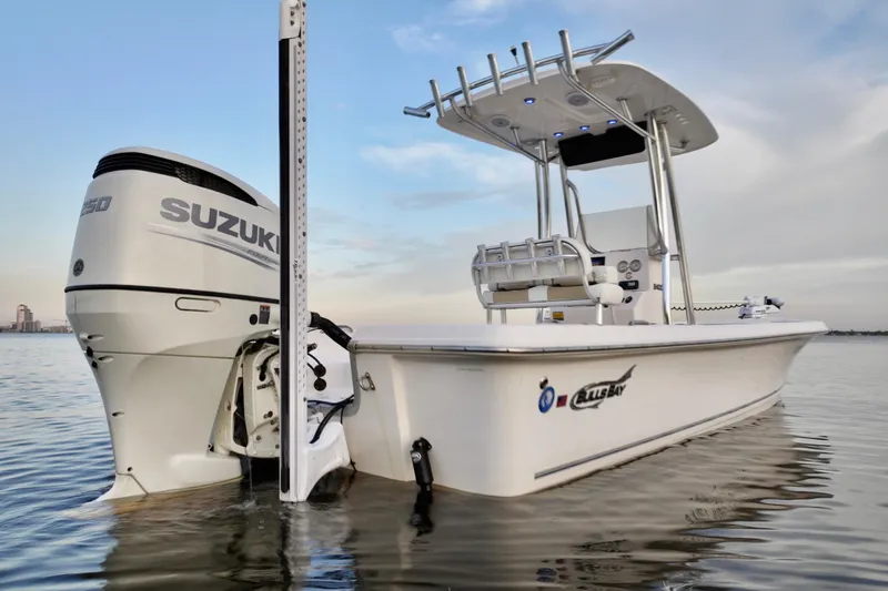 Slide: The Image of 2020 Bulls Bay 2400 boat with Suzuki engine on calm water. - 13