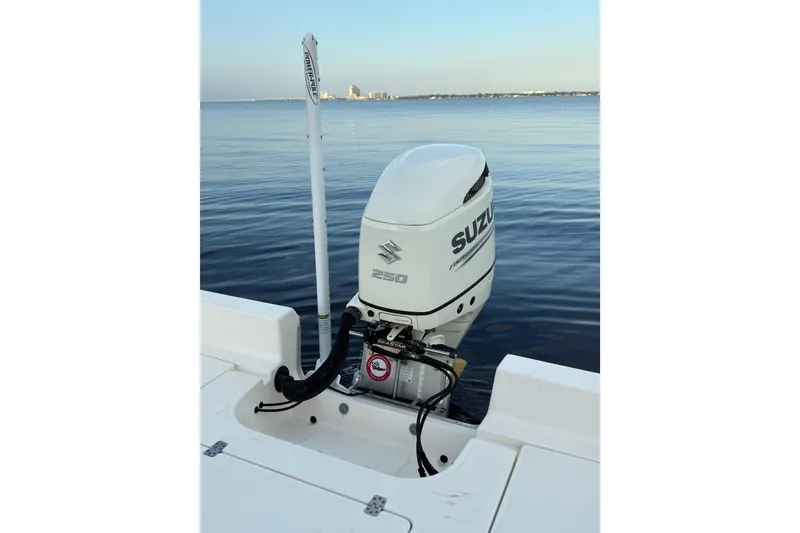Slide: The Image of Bulls Bay 2400 boat with Suzuki 250 outboard motor on calm water, 2020 model. - 22