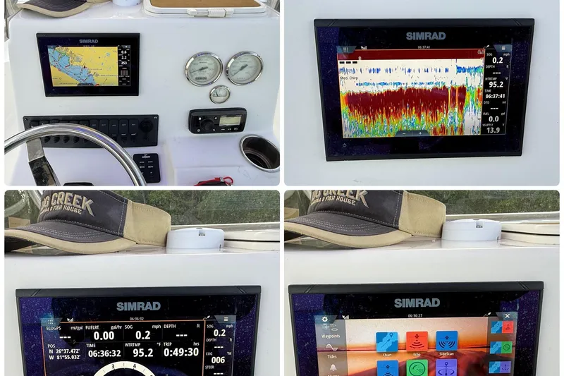 Slide: The Image of 2020 Bulls Bay 2400 boat dashboard with Simrad displays and navigation equipment. - 25