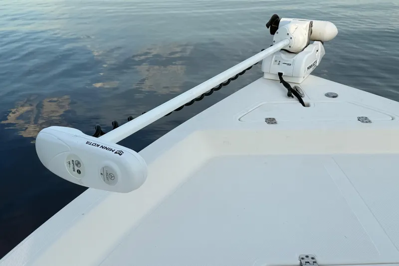 Slide: The Image of 2020 Bulls Bay 2400 boat with Minn Kota trolling motor on calm water. - 34
