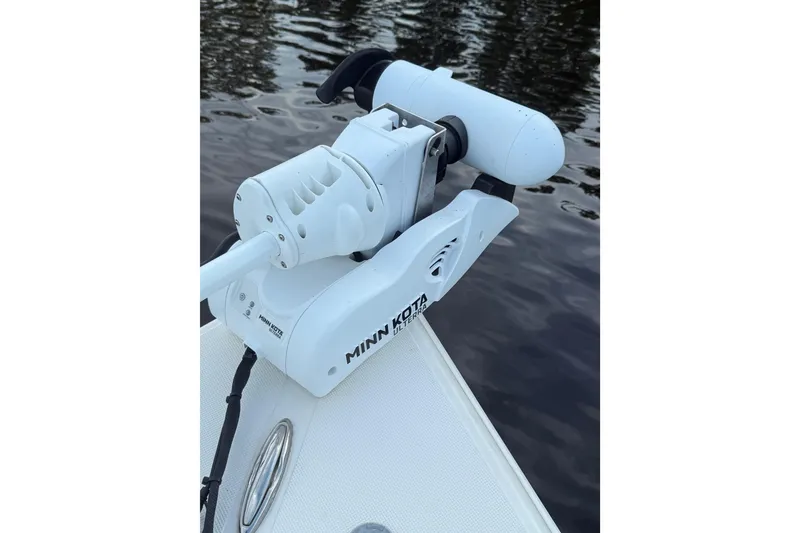 Slide: The Image of Minn Kota trolling motor on 2020 Bulls Bay 2400 boat by the water. - 35