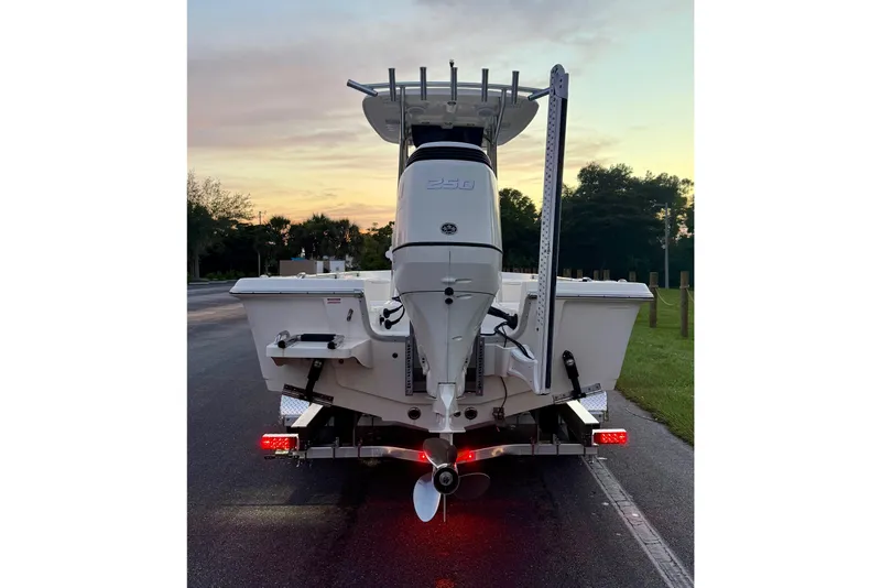 Slide: The Image of 2020 Bulls Bay 2400 boat on trailer at sunset, rear view. - 40