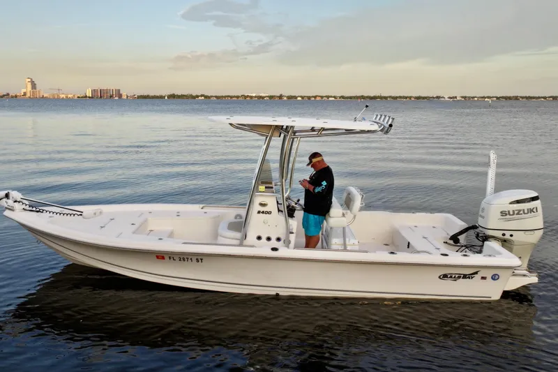 Slide: The Image of 2020 Bulls Bay 2400 boat on calm water with Suzuki outboard motor. - 5